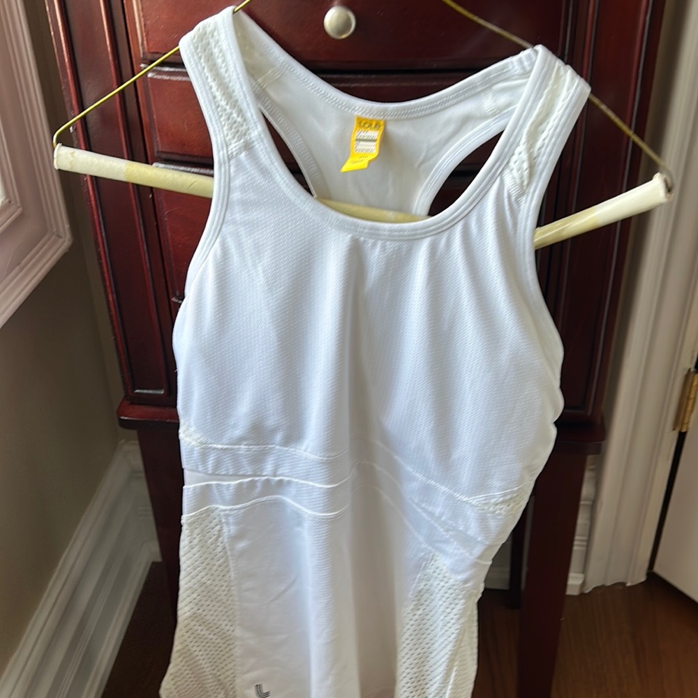 White racer back tennis top with mesh sides. Worn only once